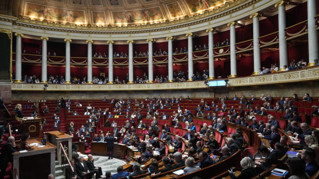 French National Assembly approves urgent budget legislation to prevent government closure.