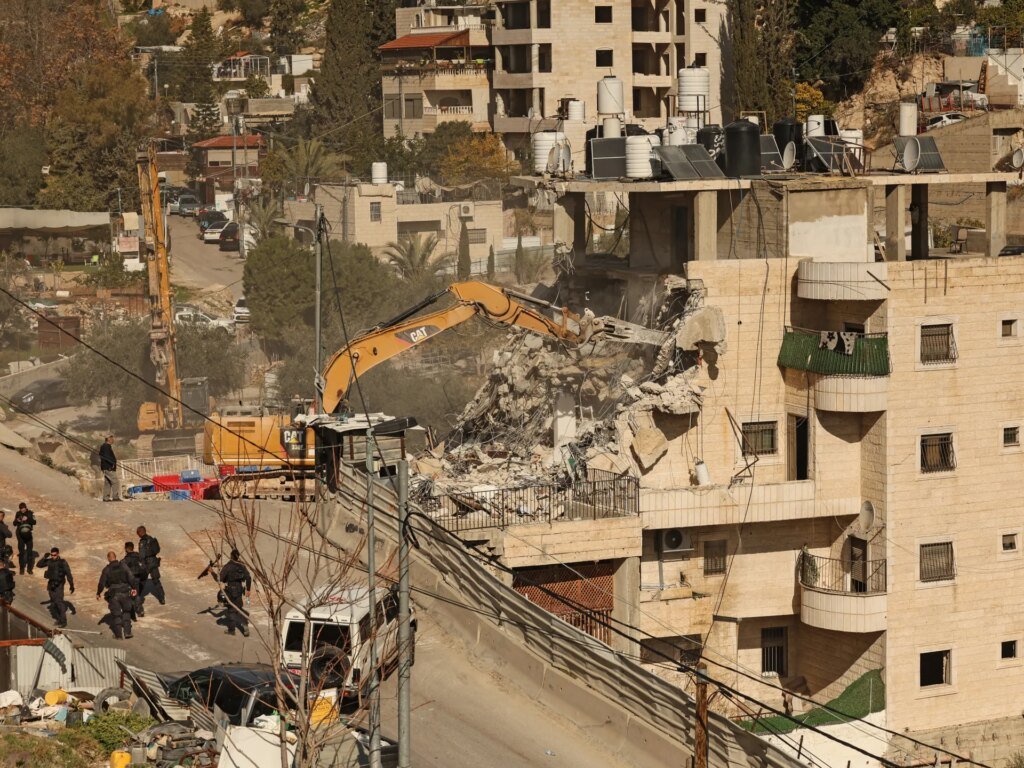 Israeli troops destroy businesses during operations close to occupied East Jerusalem.