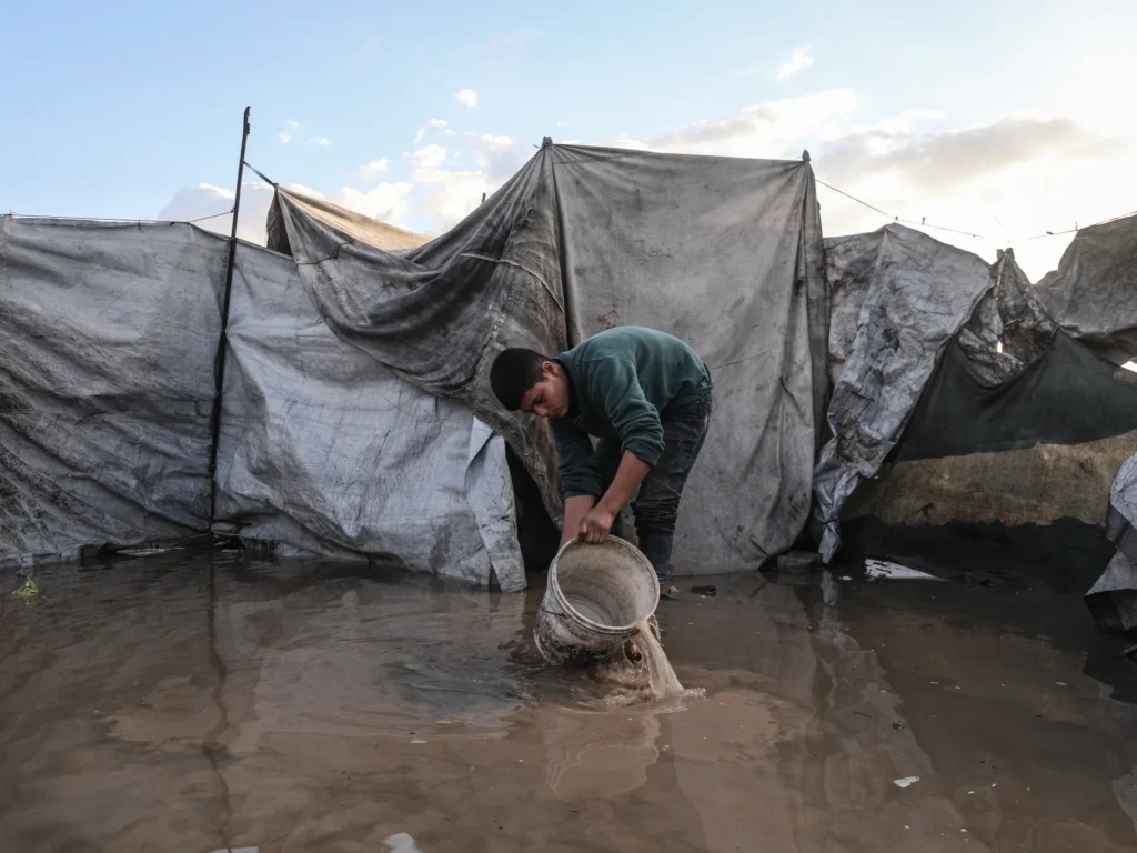 Palestinians endure soaked tents and wreckage as Gaza faces heavy rain and cold weather.