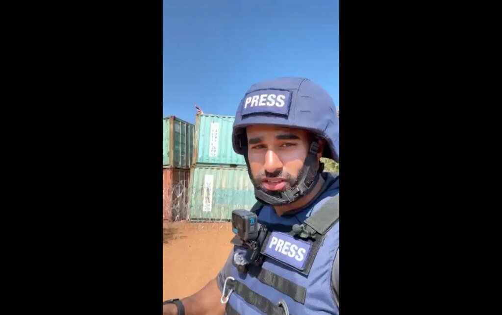 Thai troops encircle Cambodian village using shipping containers as blockade.