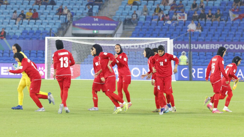 Advocates call for Australia to grant asylum to Iranian women's soccer team.